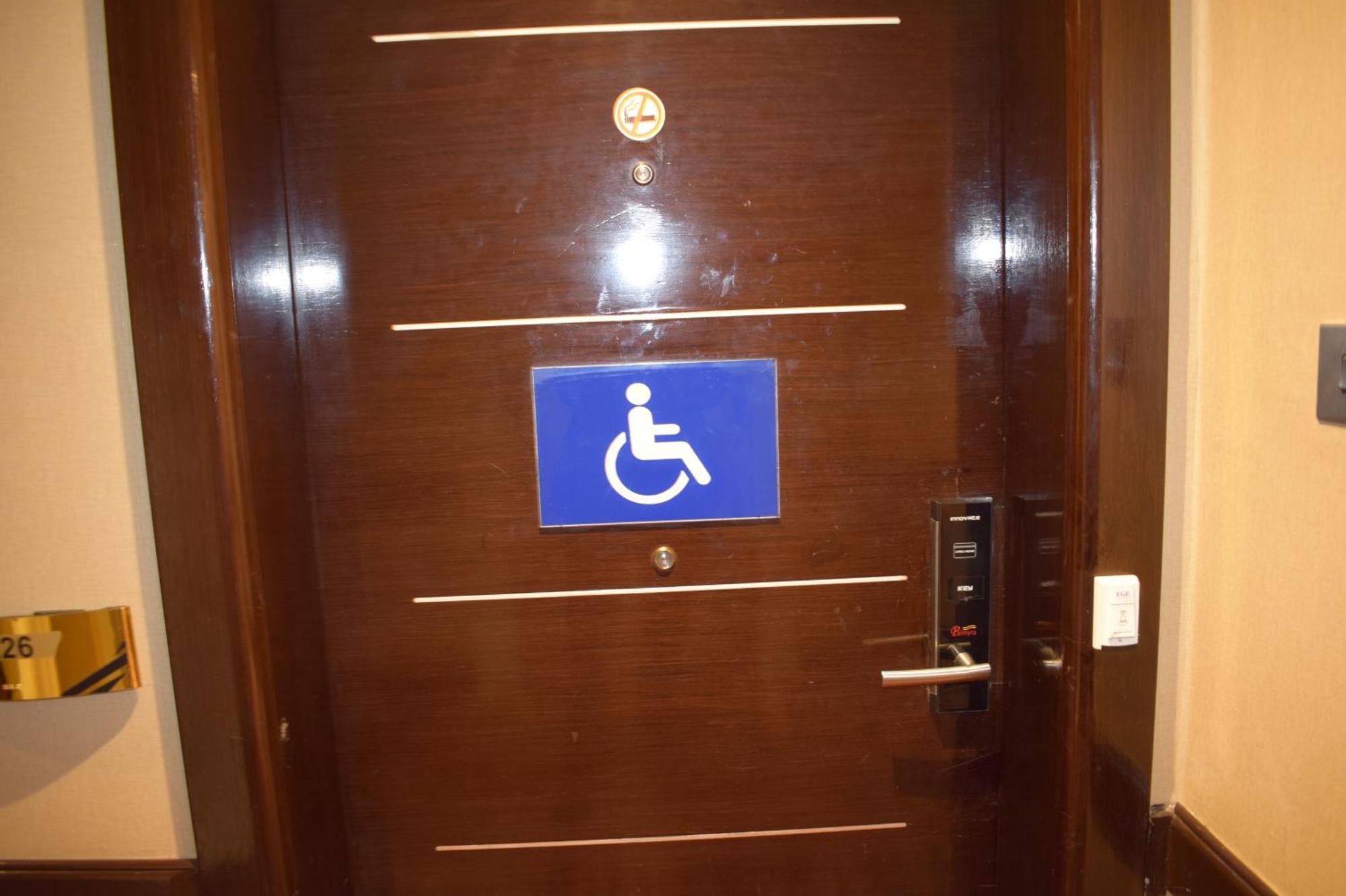 Frontel Al Harithia Hotel Medina Exterior photo A disabled toilet sign on a door