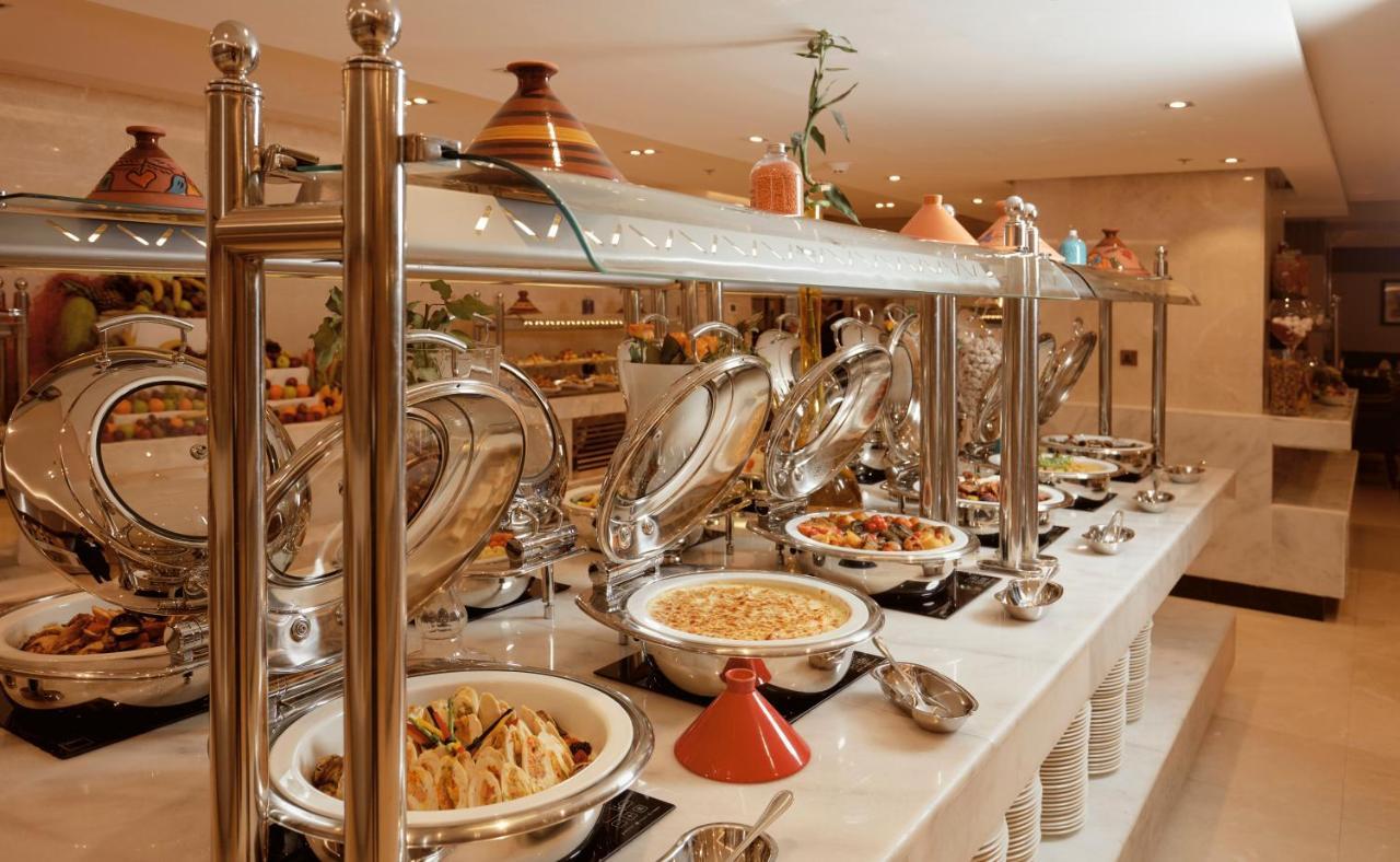 Frontel Al Harithia Hotel Medina Exterior photo A buffet at a hotel
